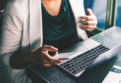Woman checking email at a coffee shop