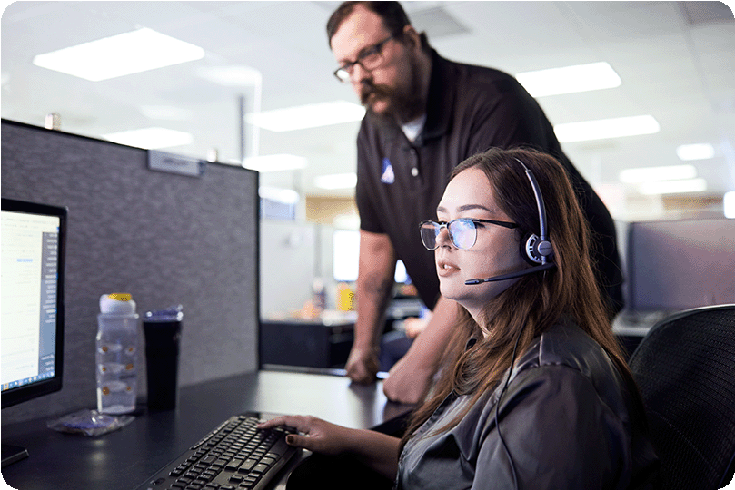 A woman providing cybersecurity services over the phone.